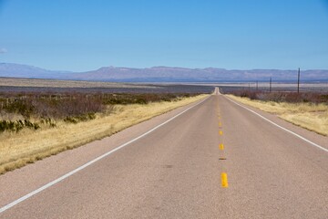 Endless desert road in West Texas USA 2
