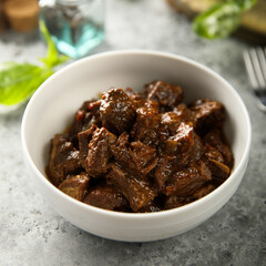 Traditional homemade beef goulash in a white bowl