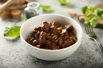 Traditional homemade beef goulash in a white bowl