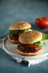 Homemade burgers with tomato and basil