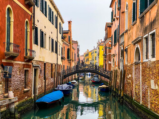 Fototapeta na wymiar Unrecognizable person walking on a bridge in Venice, Italy