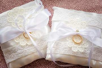 wedding rings presentation, wedding jewelry before the marriage celebration presented with strings and lace 
