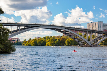 bridge over river and kayak in Stockholm, Sweden