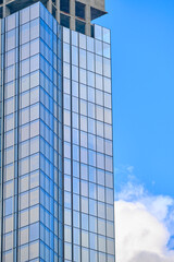 Architecture fragment of a skyscraper on the background of the sky. Business background