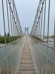 Obraz premium suspension bridge on the lake 