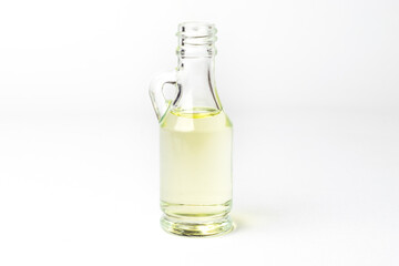 Unrefined coconut oil on a white background with wooden spoon