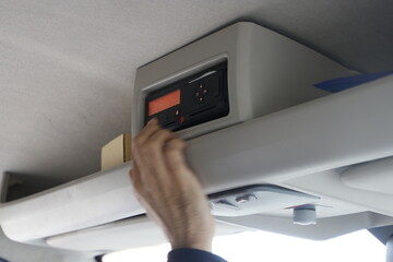 Bus driver checking the tachograph after a trip