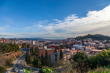 Panorama of Barcelona from Mount Tibidabo. Early morning in the outskirts of Barcelona. Landscape overlooking the outskirts of the city. View from the mountain to the city in the morning.