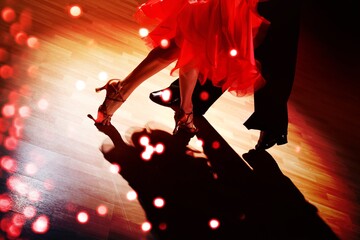 Man and woman feet dancing salsa on floor