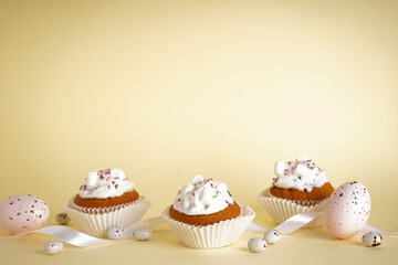 Delicious Easter cupcakes on yellow background, space for text.