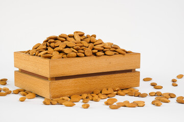 Almond in wooden box. Nuts on white.  Health food. Vegetarian Diet. Walnuts in box. Studio photo. 