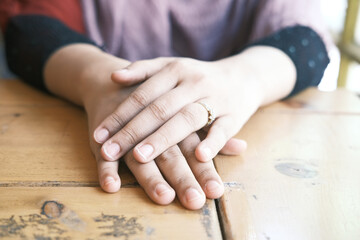 close up of women's hands with wedding ring 
