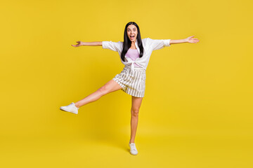 Fototapeta na wymiar Full size photo of young funky funny excited smiling careless girl fooling around isolated on yellow color background