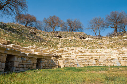 close view of historical Teos theater with stairs and steps on the slopes of Acropolis from Roman Greek period