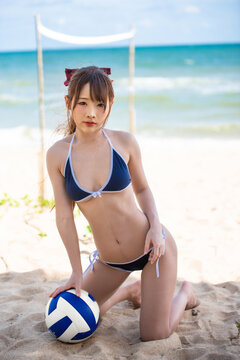 Summer Vacation, Asian Woman Playing Beach Volleyball At The Beach.