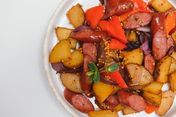 potatoes with meat and vegetables white background