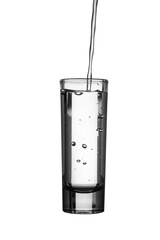 Pour water into a white background glass