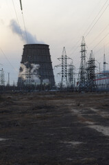 A view of the cooler of the thermal power station with a ferry near the electric rigs