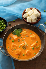 Matar Paneer curry recipe made using cottage cheese, green peas, Kerala, Delhi, Rajasthan India. Top view North Indian veg curry side dish of Roti, Chapati, naan, Pulao