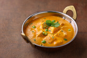 Matar Paneer curry recipe made using cottage cheese, green peas, Kerala, Delhi, Rajasthan India. Top view North Indian veg curry side dish of Roti, Chapati, naan, Pulao