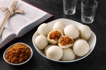 Kozhukatta Pidi and Indian milk tea Kerala tea time snack steamed food christian food Palm sunday. sweet modak rice dumpling Ganesh Festival India rice flour sweet food stuffed grated coconut jaggery 