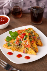 Bread omelet Indian street food with tomato sauce breakfast food non vegetarian Indian snack. snack with whole wheat bread. Protein rich kids tiffin fried egg fast food Kerala Mumbai India Sri Lanka.