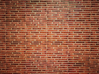 Red brick wall close up texture.