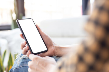 cell phone blank white screen mockup.woman hand holding texting using mobile on desk at office.background empty space for advertise.work people contact marketing business,technology