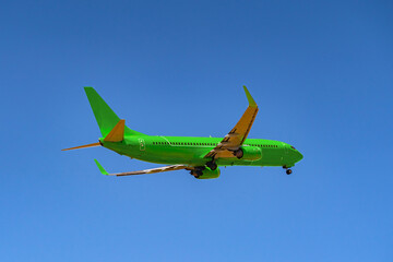 Passenger airplane flying against clear blue sky
