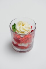 Tasty milk shake with chocolate topping on white background