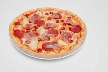 Thinly sliced pepperoni is a popular pizza topping in American-style pizzerias