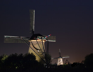 Two windmills at night at Kinderdijk