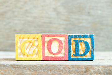 Color alphabet letter block in word COD (Abbreviation of cash on delivery or cash on demand) on...