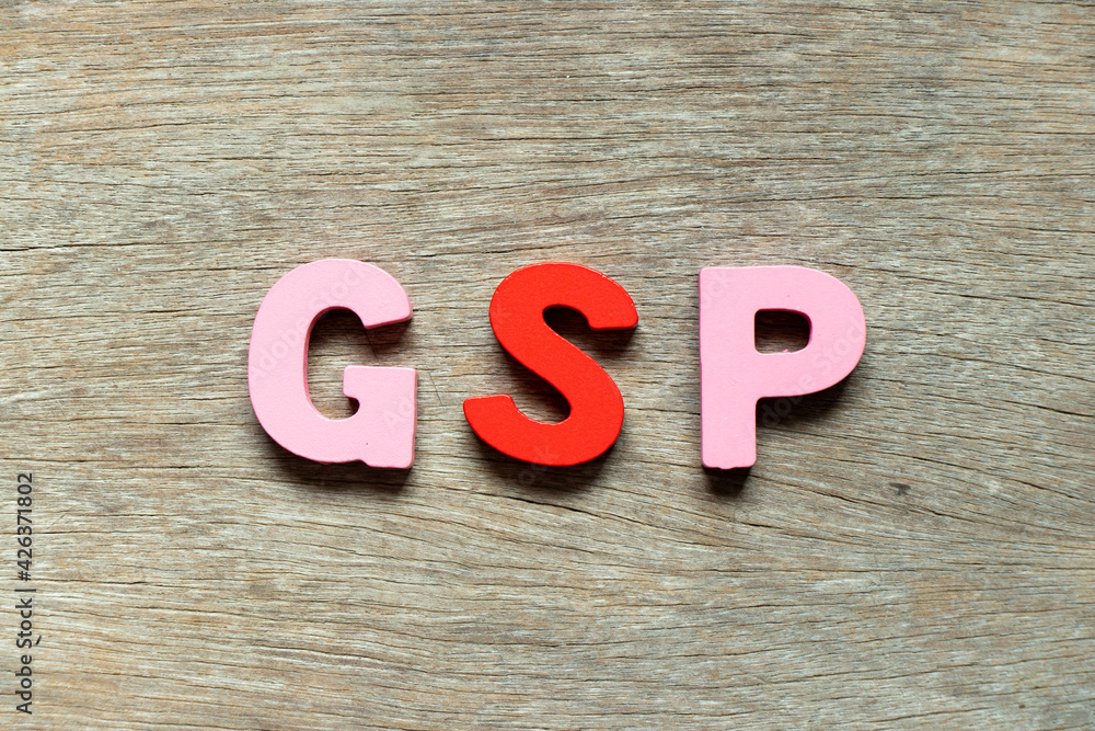 Sticker Color alphabet letter in word  GSP (Abbreviation of Good Storage Practice or Generalized System of Preferences or Gross State Product) on wood background