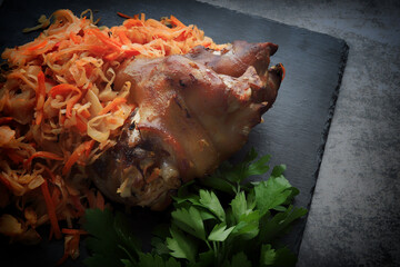 Pork knee with stewed cabbage. A traditional German or Czech dish. Aysban.