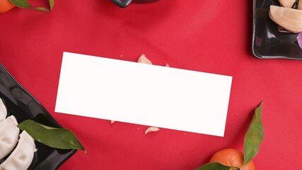 The Opens traditional wish cookie is spinning in the center. Prediction of the future in the Chinese new year and typical food for the holiday on a red background. Stop motion. FullHD footage - Powered by Adobe