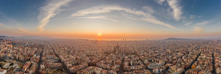 Barcelona, Spain - Feb 25, 2020: Aerial panorama shot of Barcelona coastline sun rising over...