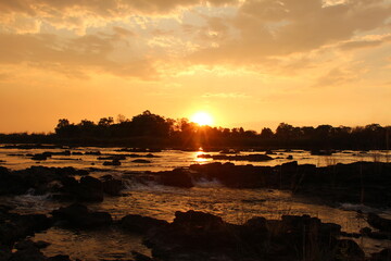 Naklejka premium beautiful sunset at the okavango river in namibia