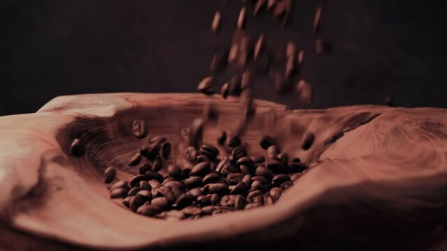 Falling grains of coffee. Falling Fragrant roasted coffee beans