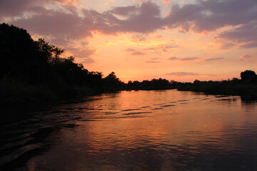beautiful sunset at the okavango river in namibia