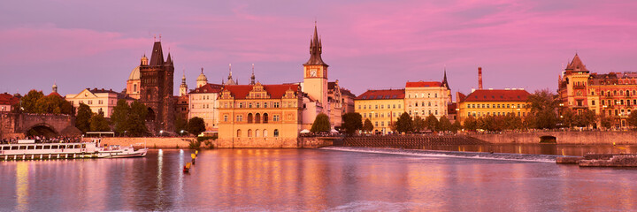 Fototapeta na wymiar Prague, riverside on sunset with reflection