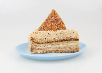 image of a cake piece lie on ceramic plate over a white background