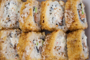 Sushi roll with salmon and shrimp tempura