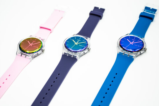 Paris, France 07.10.2020 - Three Swatch swiss made quartz watch isolated on white background. colored plastic case Fluorescent colors youth hipster style watch for bright image. Swatch Group