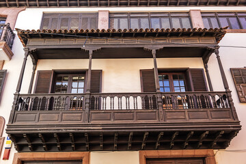 Typical Canary Island colourful architecture with wooden decorative elements on the island of Tenerife. San Cristobal de La Laguna, Tenerife, Canary Islands, Spain.