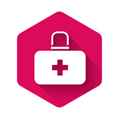 White First aid kit icon isolated with long shadow background. Medical box with cross. Medical equipment for emergency. Healthcare concept. Pink hexagon button. Vector