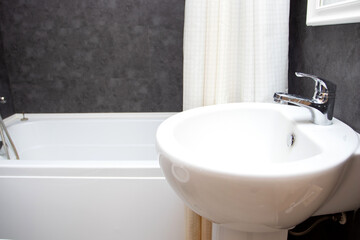 Naklejka na ściany i meble Bathroom sink and faucet in modern bathroom interior. Washbasin and bath