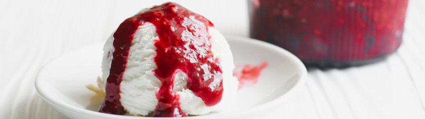 Ice cream ball with raspberry jam with copy space banner