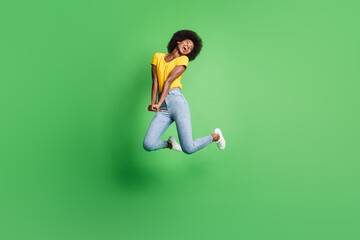 Full size photo of young beautiful charming smiling lovely dreamy girl jumping look copysapace...