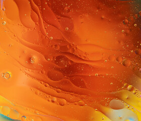 oil drops on water with vivid colorful background